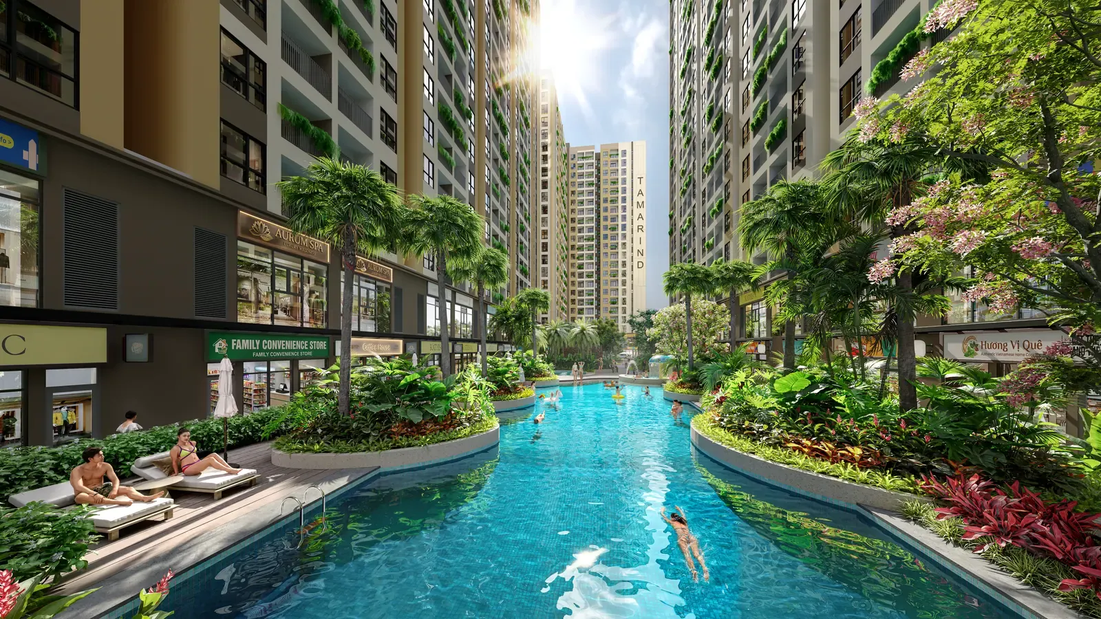 Hồ bơi chuẩn resort Bcons Central Park Tam Hiệp với ghế nằm ven bờ và cây xanh nhiệt đới
